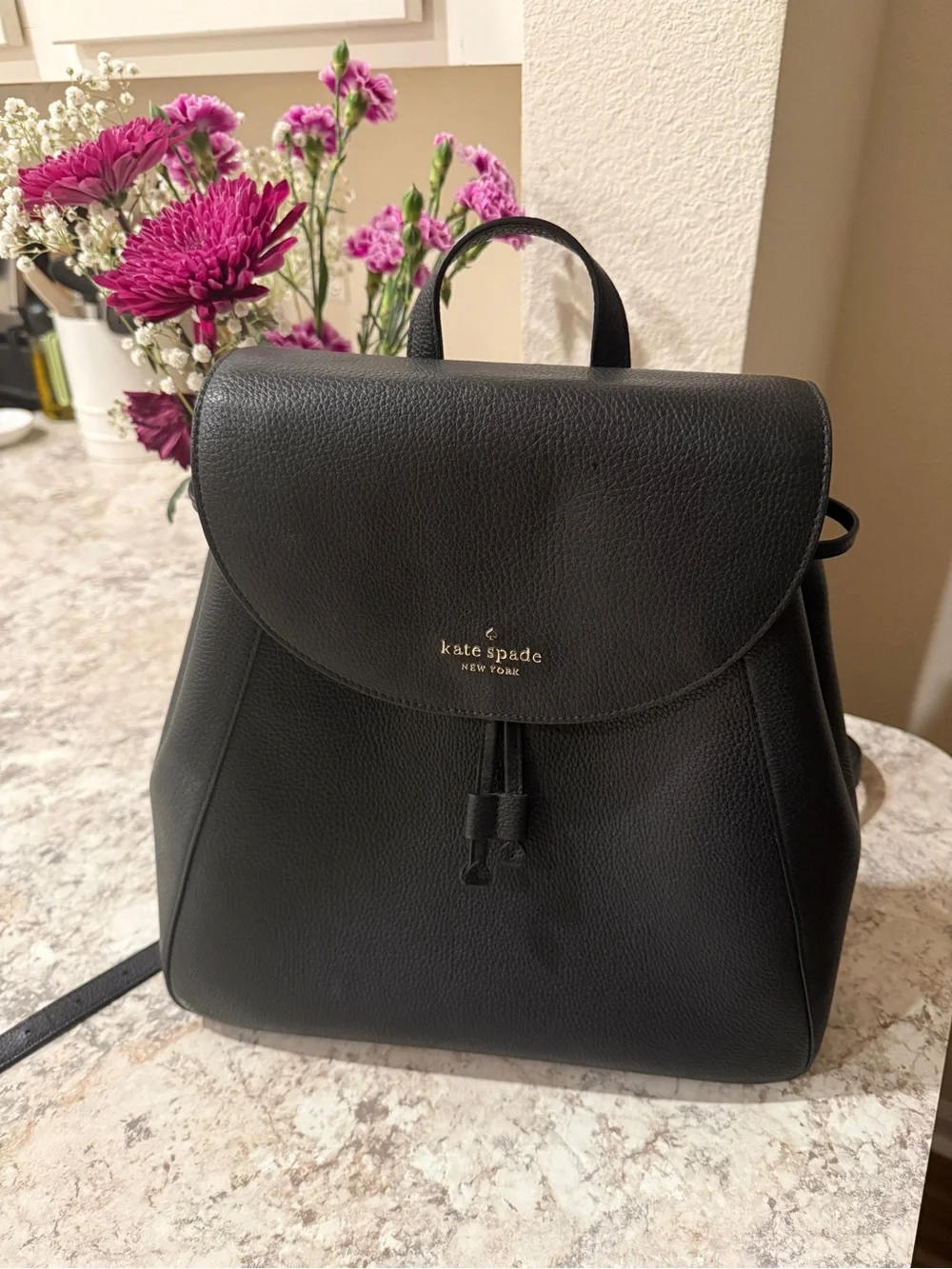 kate spade Black Pebbled Leather Backpack with Gold Logo